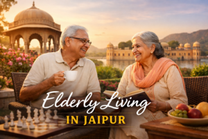 Elderly Indian couple enjoying peaceful outdoor time in Jaipur with tea, book, and scenic heritage view, representing comfortable and happy senior living in Jaipur